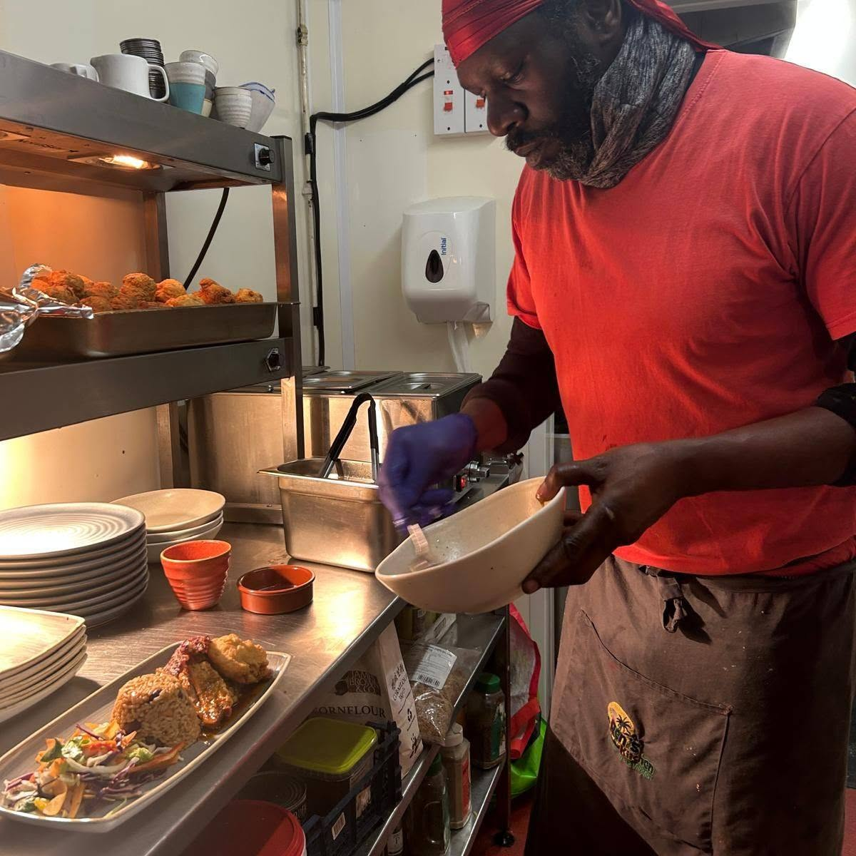 Chef Renoll Webb preparing Caribbean dishes in his Blyth kitchen